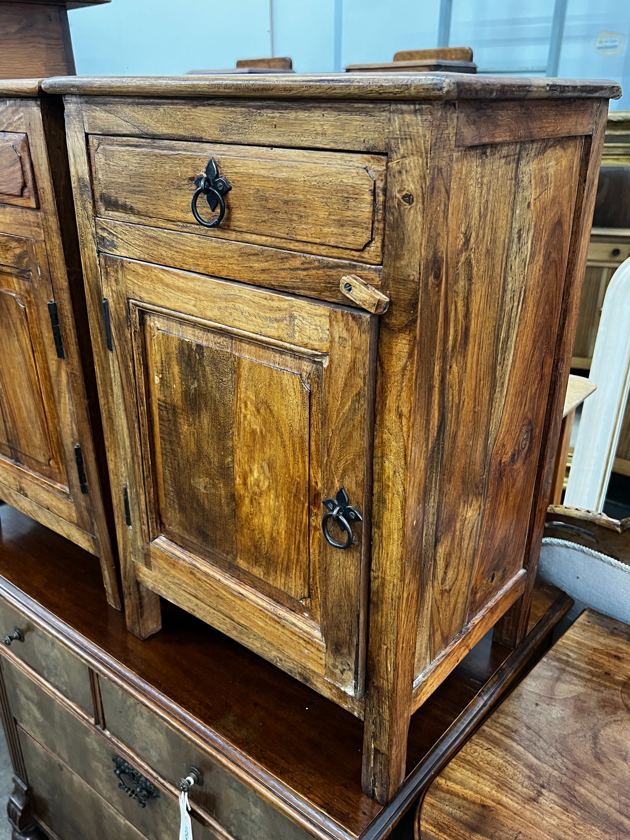 A pair of Indonesian hardwood bedside cabinets, width 43cm, depth 31cm, height 64cm